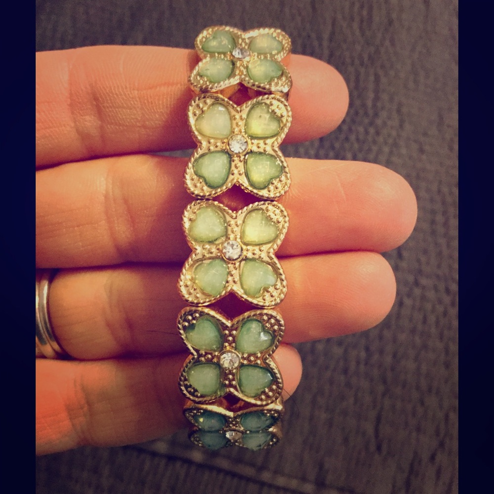Gold bracelet with mint green jewels