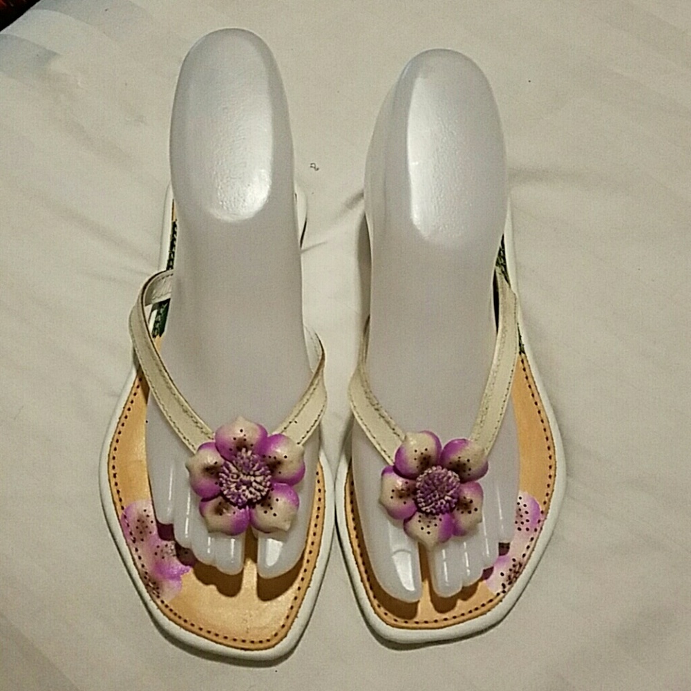 Hand painted thong sandals.
