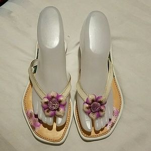 Hand painted thong sandals.
