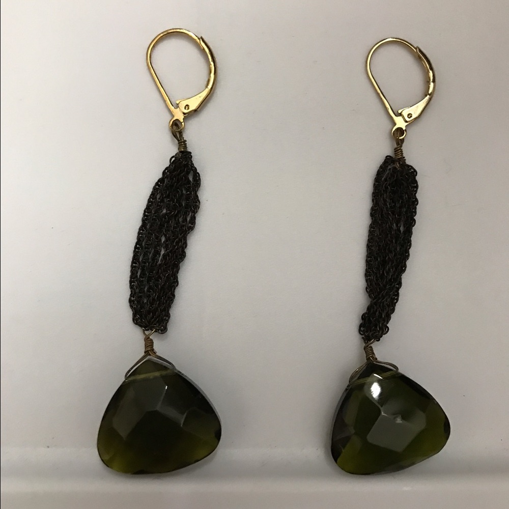 Hanging earring with gold hooks, and green gems,