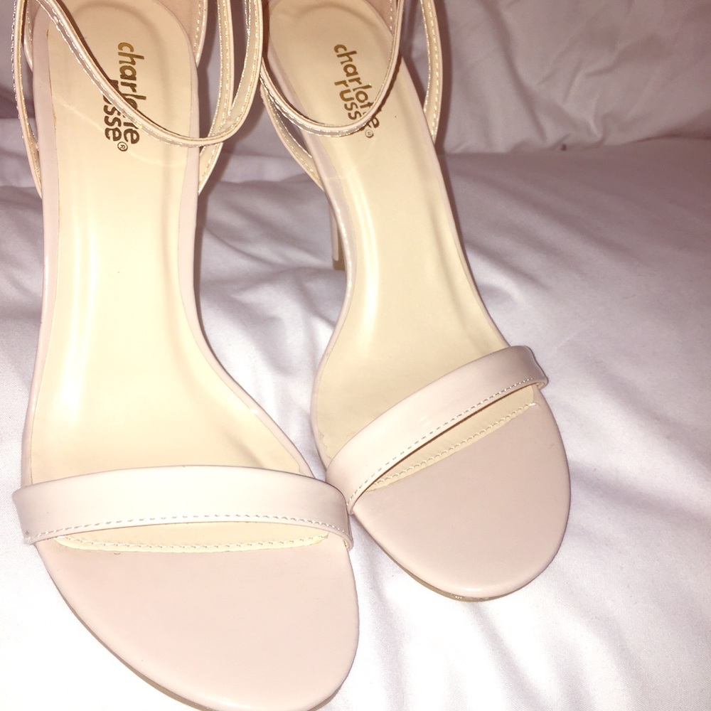 Nude ankle strap heels.