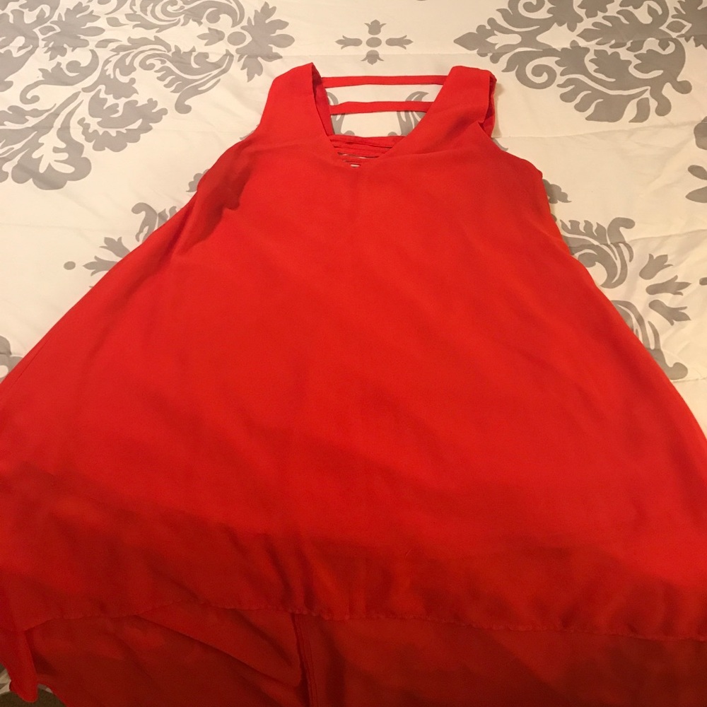 Flowy red high-low top with a deep V in the back!