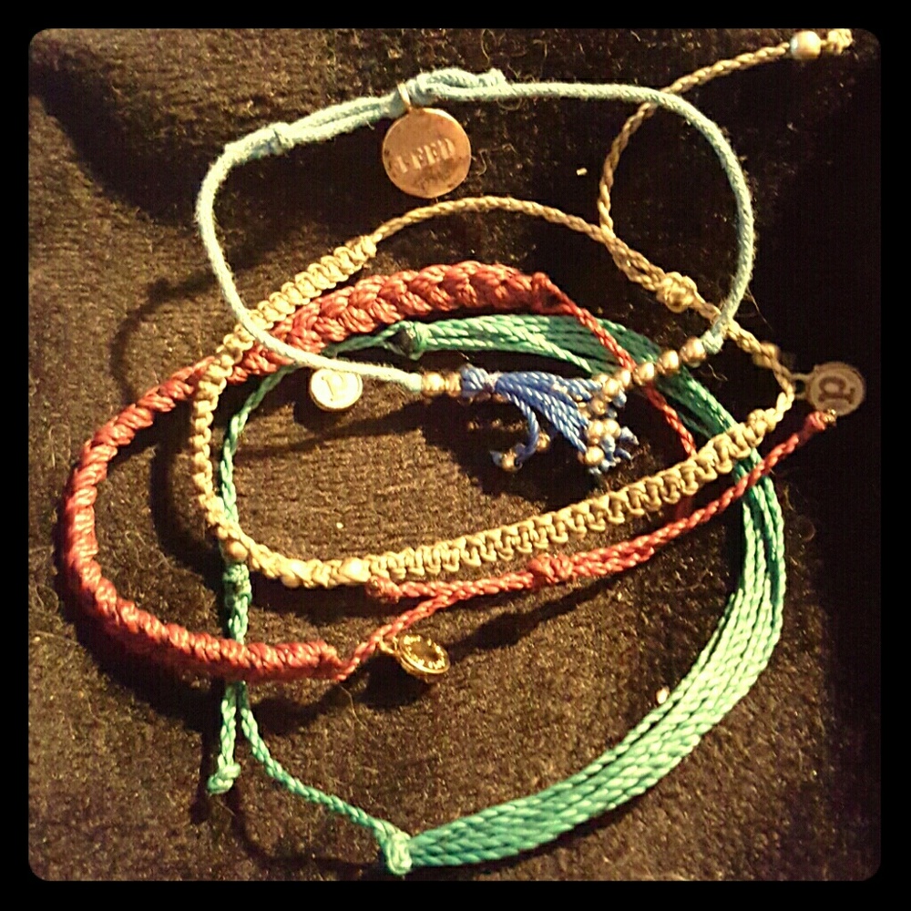 Stack of 4 colorful cotton bracelets