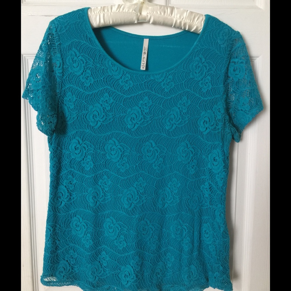Top short sleeve with lace overlay.  Turquoise