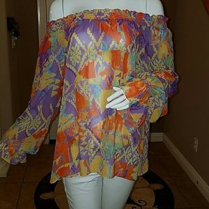 Off shoulder colorful blouse.