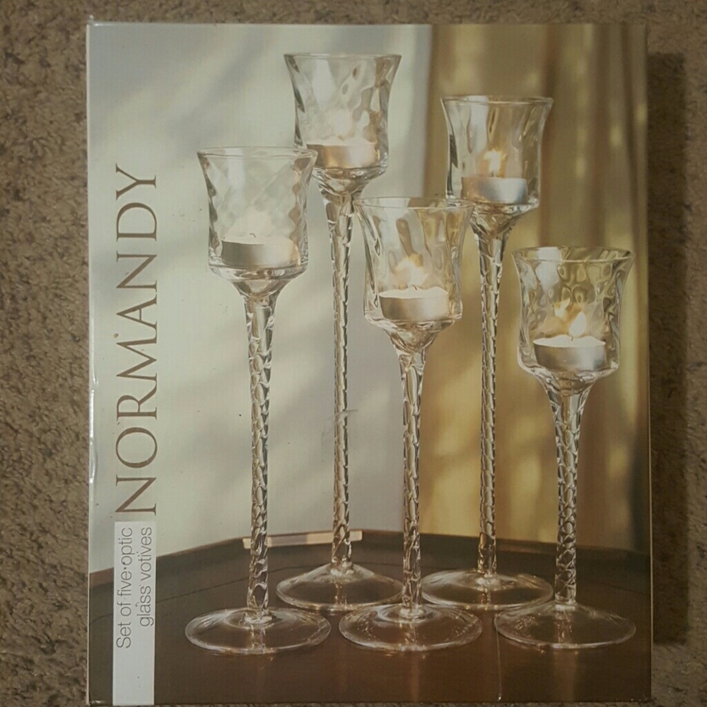 A set of five optic glass votives