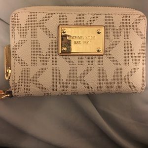 Wallet clutch can fit a smaller smart phone.