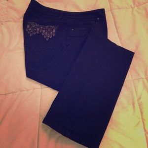 Black boot cut denim jeans.