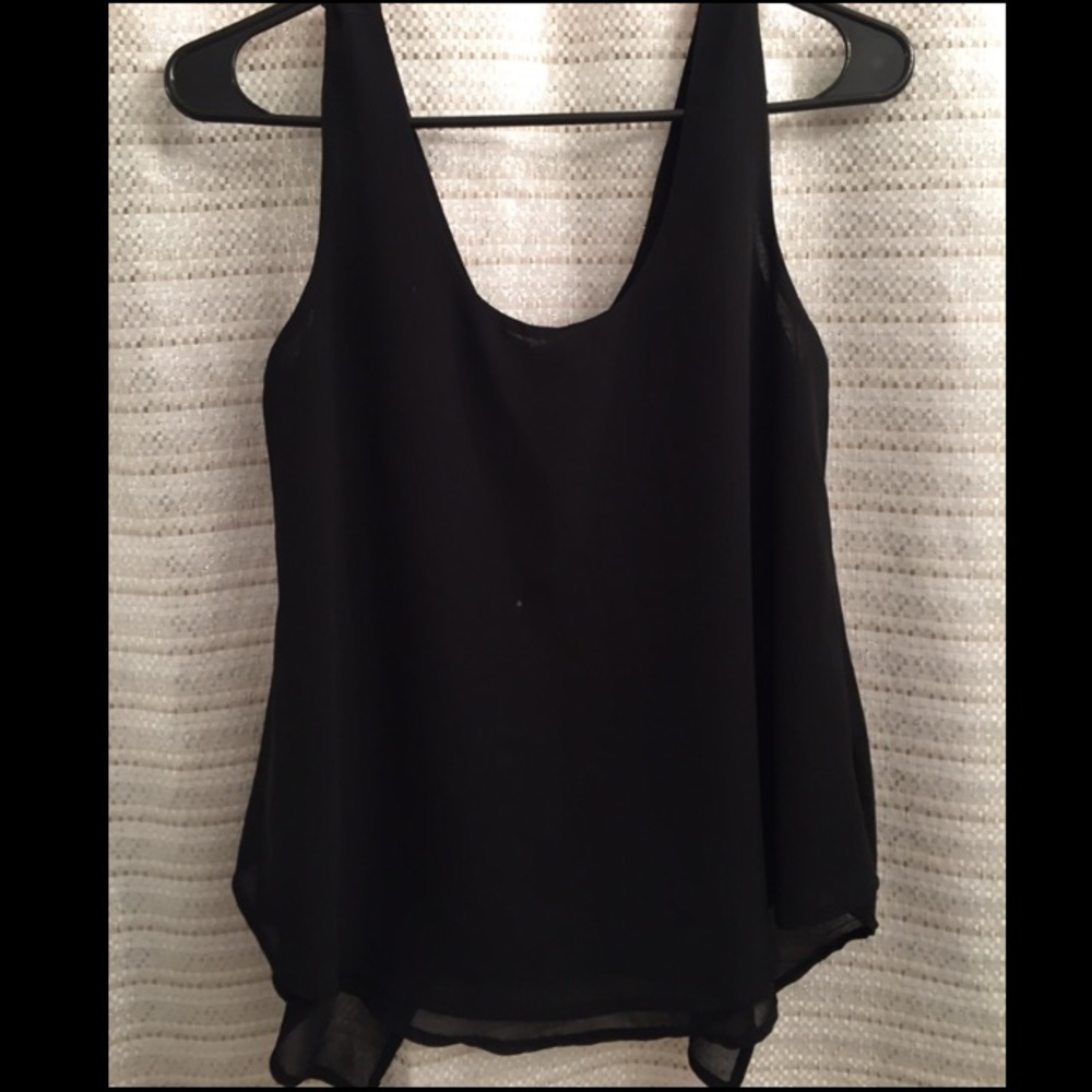 Sheer black top with bow detail on the back!