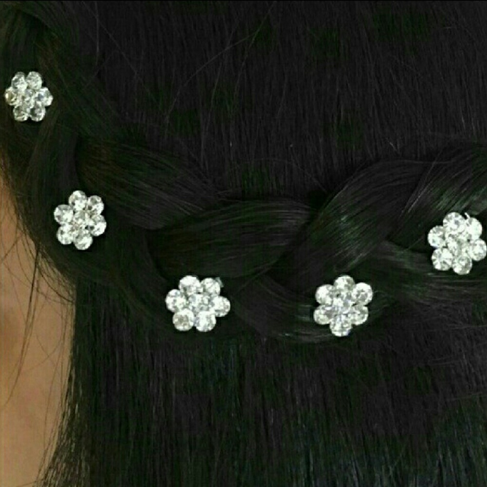 Rhinestone flower hair twists.