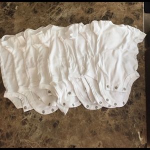New! Carter white onesies. Set of 9