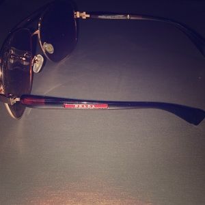 Sunglasses by Prada