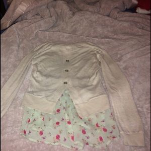 Tan and floral sweater.