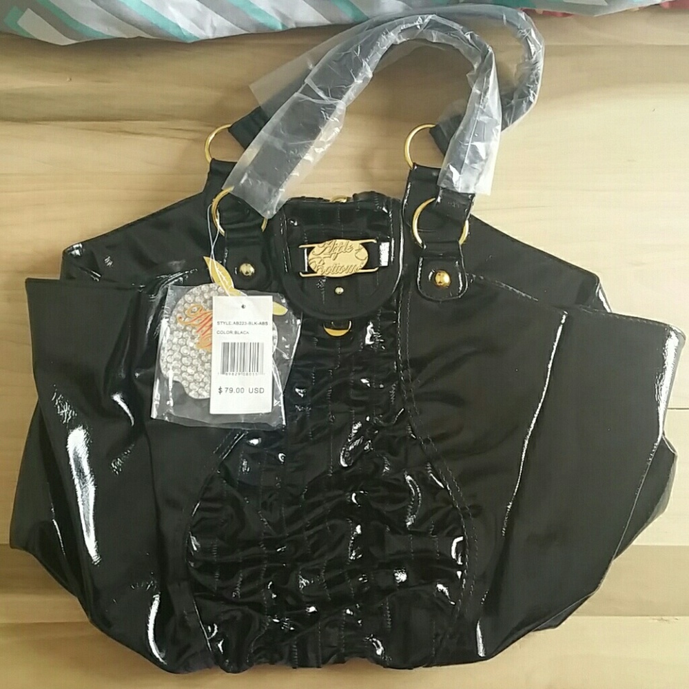 Black ruffle apple bottoms bag