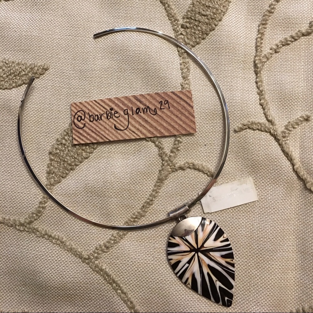 Silver necklace with shell pendent.