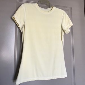 Pale yellow Lululemon tee shirt