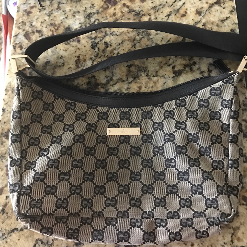 Tan Gucci with black G'S (worn)