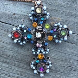 Fun and quirky jeweled cross necklace!