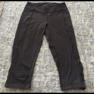 Cropped lululemon pants with cinching on the sides