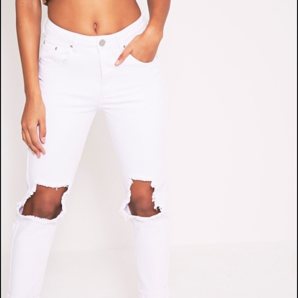 White jeans with rips on the knees