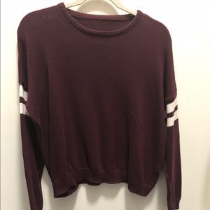 Burgundy Sweater with White Stripes on the sleeves