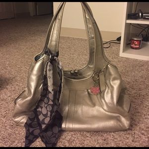 Silver metallic coach purse