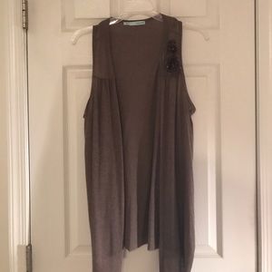 Brown sweater vest with flower