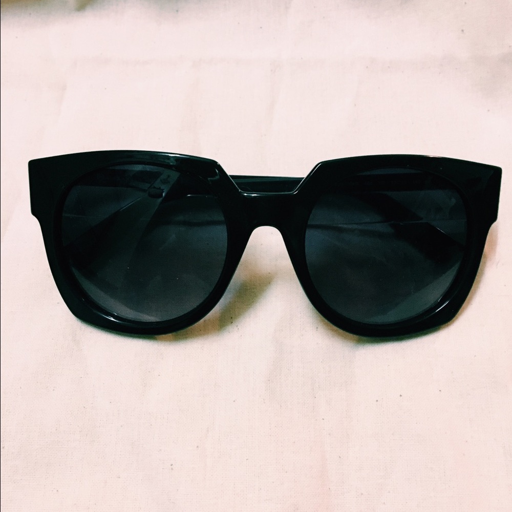 Alexander McQueen black sunglasses.