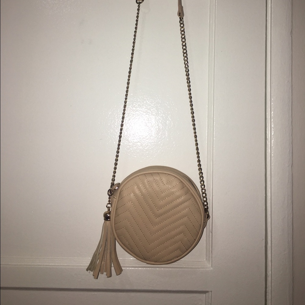 Quilted faux leather circular crossbody bag