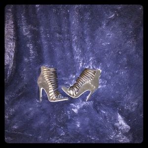 Strapped hollow high heel.