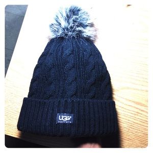 Ugg hat with fuzzy ball and fur inside
