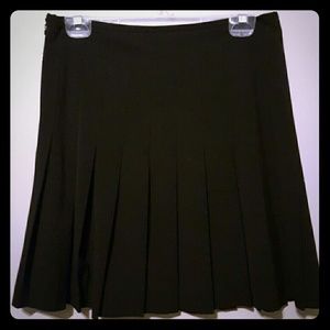 Black Norma Kamali career skirt box pleats
