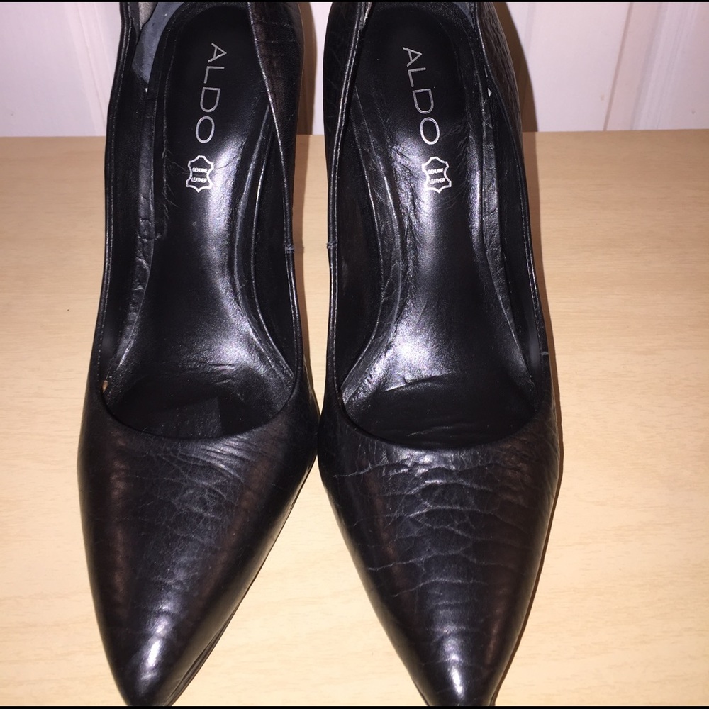 Black leather pumps