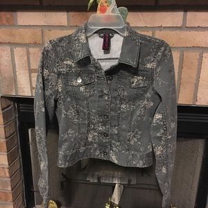 Gray jacket with flowers.