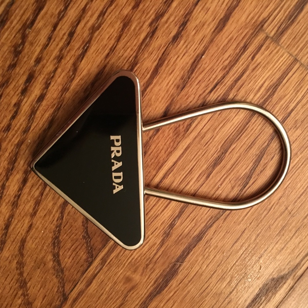 Prada triangle key ring.  Black with silver.