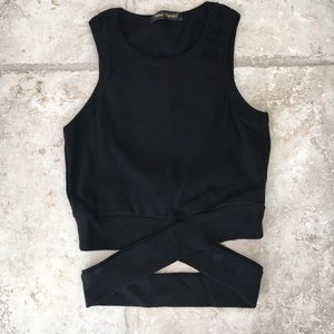 Black crop tank strap wrap around stomach. Sz: S