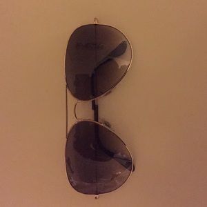 Brown and gold Rayban aviators