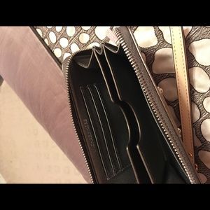 Shiny silver MK wristlet