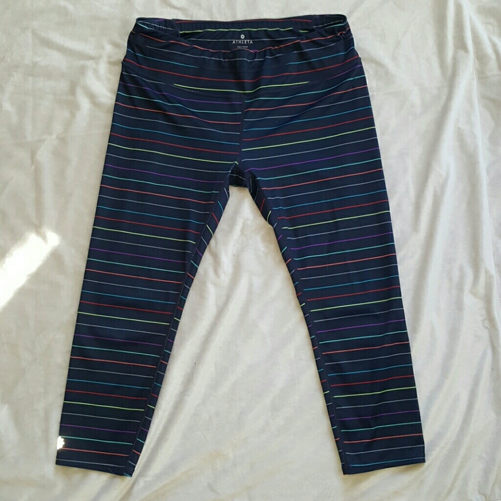 ATHLETA Navy, multi-color stripped capri leggings.