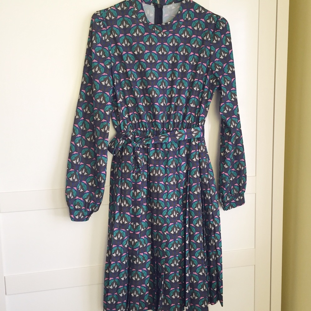 Long sleeve pleated dress.