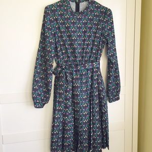 Long sleeve pleated dress.