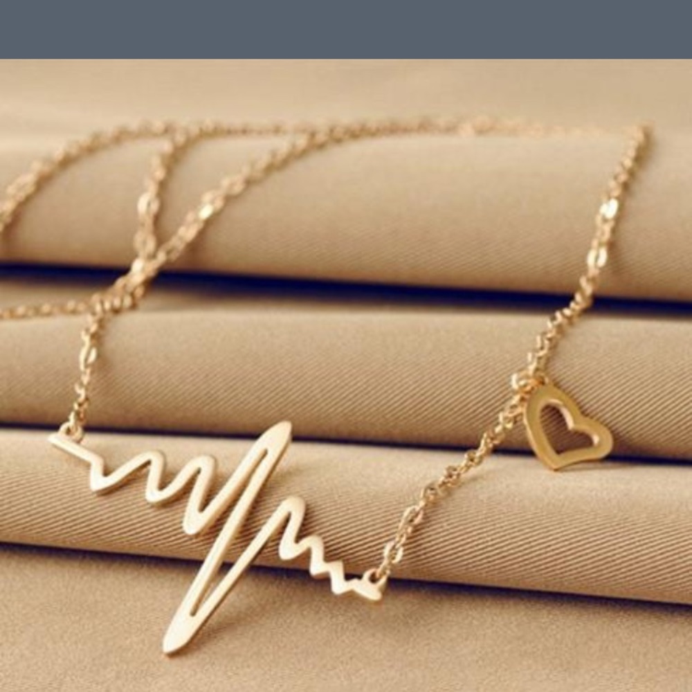 Heartbeat necklace (new in package).