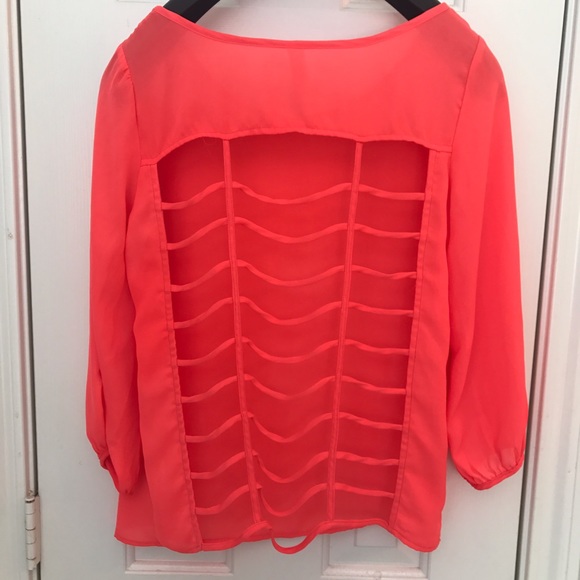 Orange top with open caged back. 3/4 sleeve - Picture 3 of 8