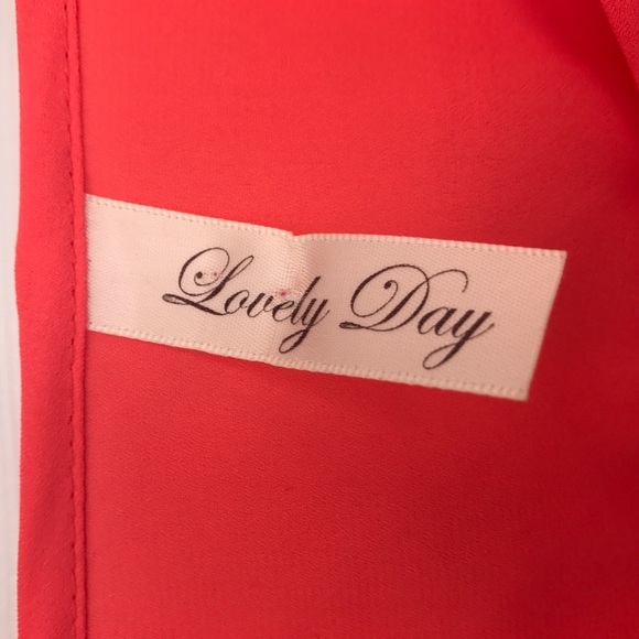 Orange top with open caged back. 3/4 sleeve - Picture 6 of 8