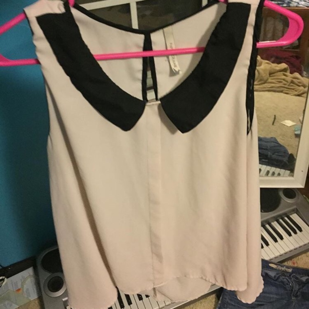 Cream with black collared blouse