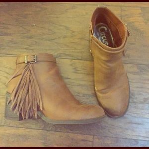 Brown heeled boots with embellishment