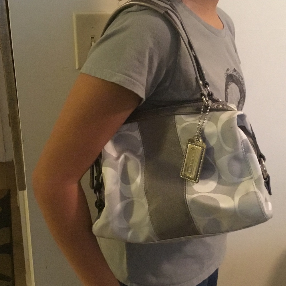 Gunmetal and silver Coach bowler with dust bag.