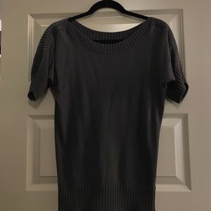 Grey light sweater top with ribbed neck hole