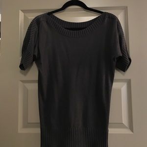 Grey light sweater top with ribbed neck hole