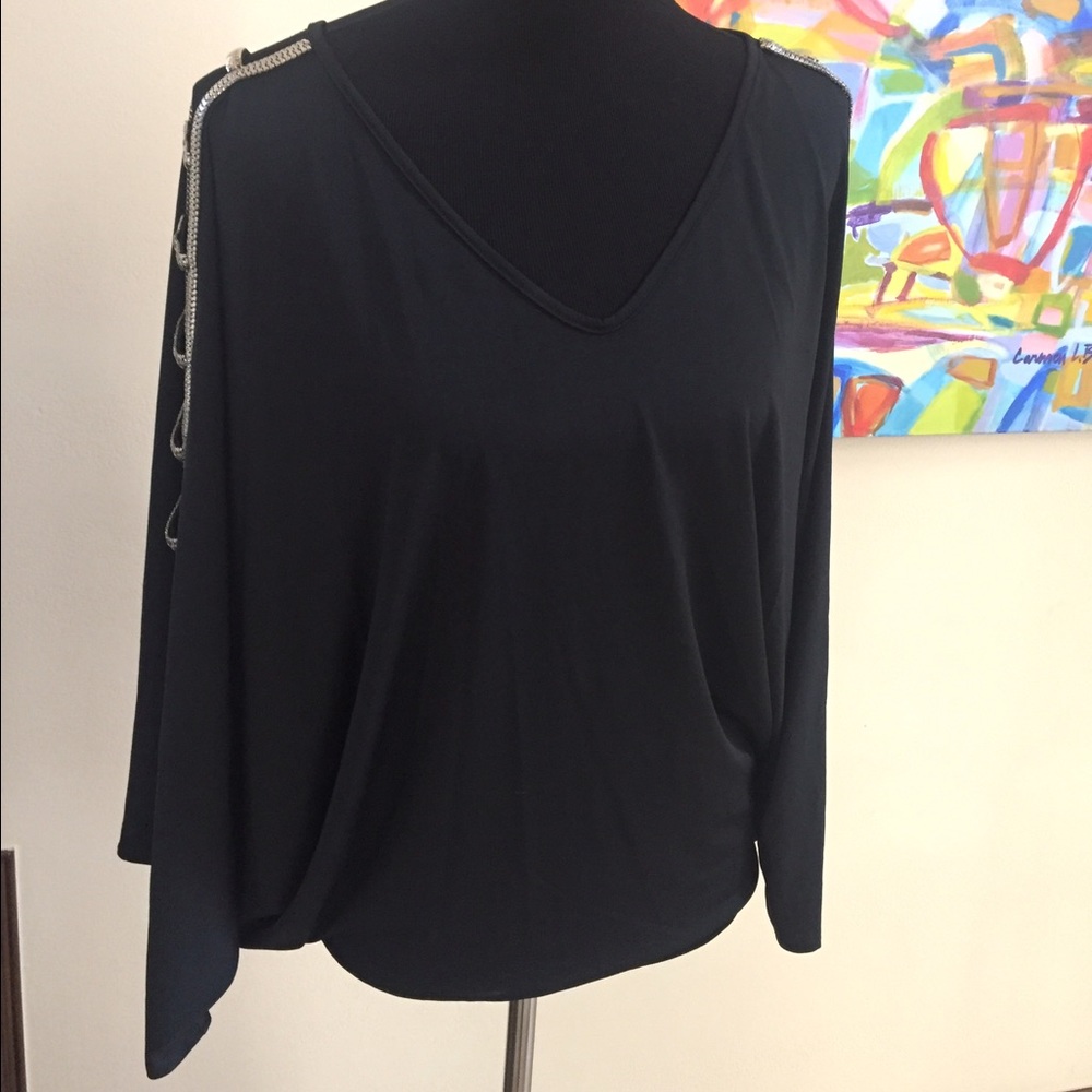 Batwing metallic silver detail on sleeve